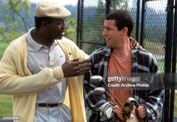 Carl Weathers talks to Adam Sandler in a scene from the film 'Happy Gilmore', 1996.