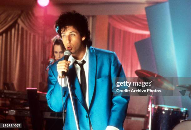 Adam Sandler sings in a scene from the film 'The Wedding Singer', 1998.