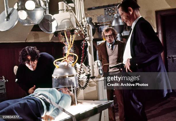Woody Allen and John Carradine watch experiment on woman in a scene from the film 'Every Thing You Always Wanted To Know About Sex * But Were Afraid...