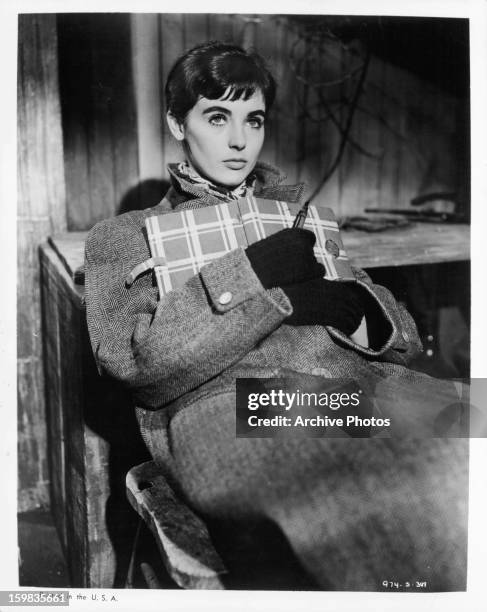 Millie Perkins holding diary in a scene from the film 'The Diary Of Anne Frank', 1959.