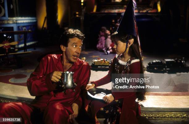 Tim Allen with Paige Tamada as an Elf in a scene from the film 'The Santa Clause', 1994.