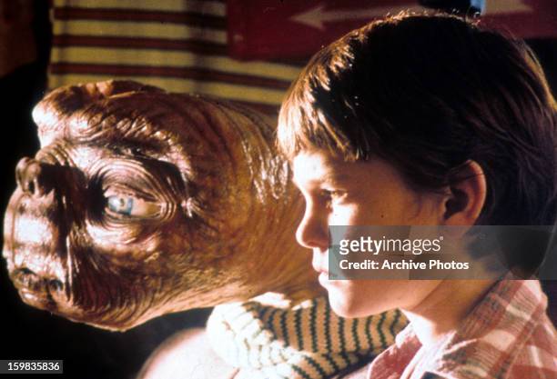 Looking out window with Henry Thomas in a scene from the film 'E.T. The Extra-Terrestrial', 1982.