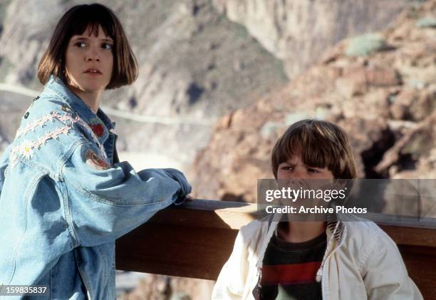 Sabrina Lloyd and Brian Bonsall at lookout point in a scene from the film 'Father Hood', 1993.