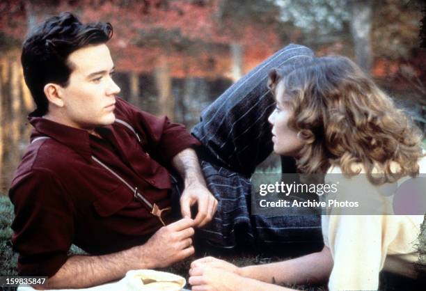 Timothy Hutton and Kelly McGillis relaxing together in a scene from the film 'Made In Heaven', 1987.