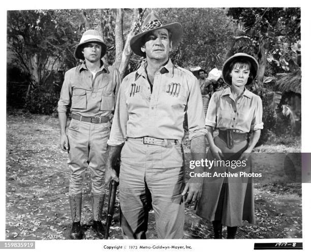 Jean Sorel, Rod Taylor, and Anne Heywood looking ahead in a scene from the film 'Trader Horn', 1973.