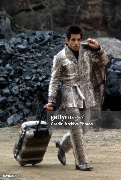 Ben Stiller with a rolling a suitcase in a scene from the film 'Zoolander', 2001.