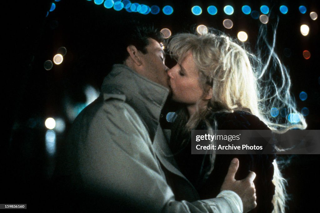 Mickey Rourke kisses Kim Basinger in a scene from the film 'Nine
