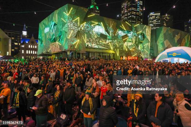 Fans At Melbourne's Federation Square watch the Matildas FIFA World Cup round of 16 match against Denmark, being played in Sydney, on August 07, 2023...