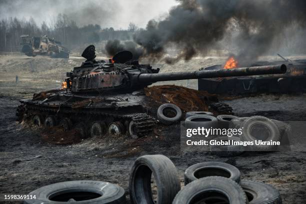 Burning tank is seen during Ukrainian military practice assault tactics at a military training area before the counteroffensive operation during...