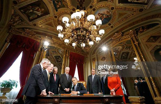 President Barack Obama is surrounded by Senate Majority Leader Sen. Harry Reid , Sen. Lamar Alexander , Sen. Chuck Schumer , Vice President Joe...