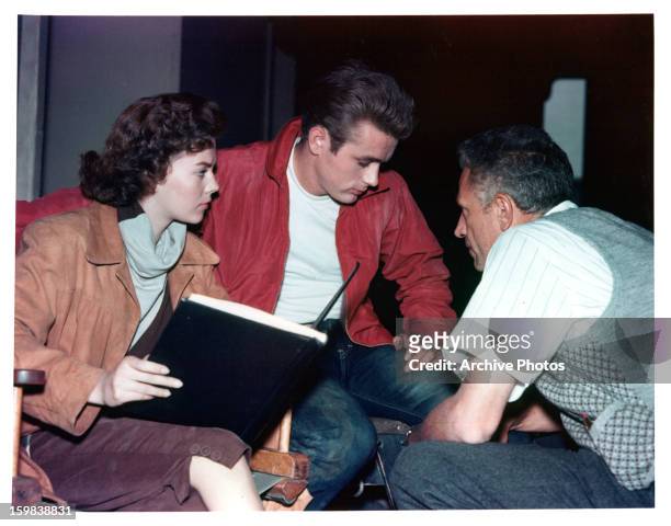 Natalie Wood and James Dean listen to director Nicholas Ray on set of the film 'Rebel Without A Cause', 1955.