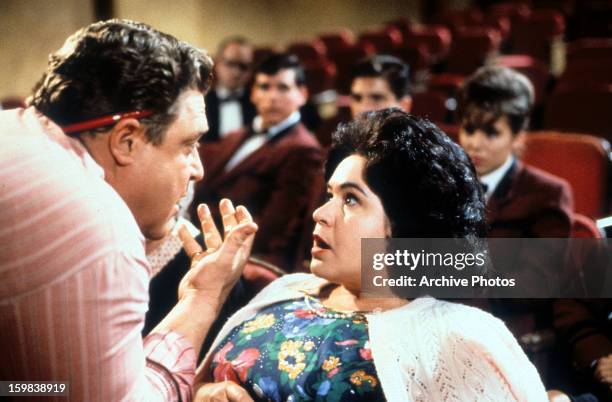 John Goodman emoting over woman in a scene from the film 'Matinee', 1993.