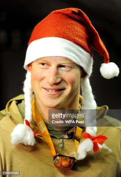In this image released on January 21 Prince Harry wears a Santa hat at the VHR tent close to the flight-line at the British controlled flight-line at...