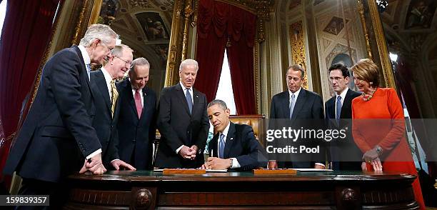 President Barack Obama is surrounded by Senate Majority Leader Sen. Harry Reid , Sen. Lamar Alexander , Sen. Chuck Schumer , Vice President Joe...