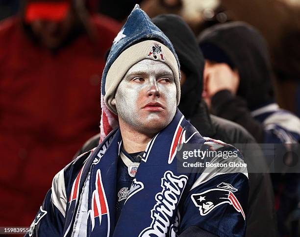 Dejected Patriots fan is pictured in the stands late in the game as the New England Patriots hosted the Baltimore Ravens in the AFC Championship Game...