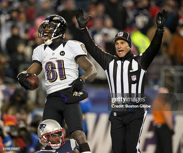 Baltimore Ravens player Anquan Boldin celebrates his touchdown reception, beating New England Patriots player Devin McCourty, during fourth quarter...