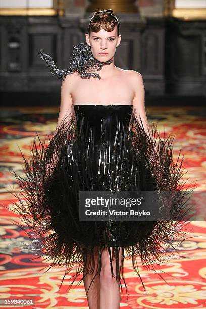 Model walks the runway during Iris Van Herpen Spring/Summer 2013 Haute-Couture show as part of Paris Fashion Week at on January 21, 2013 in Paris,...