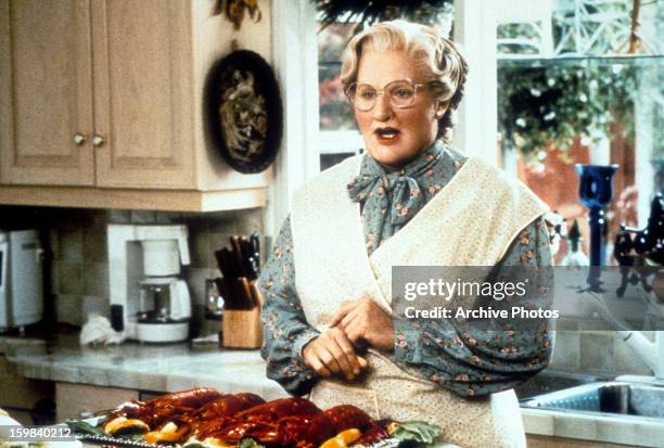 Robin Williams in the kitchen in a scene from the film 'Mrs. Doubtfire', 1993.