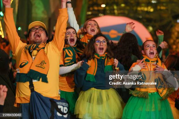 Australia fans celebrate at Melbourne's Federation Square after the Matildas scored the opening goal in their FIFA World Cup round of 16 match...