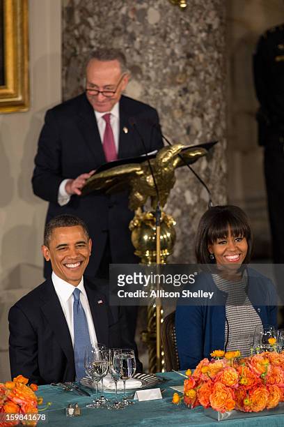 President Barack Obama and first lady Michelle Obama listen as Sen. Charles Schumer, Chairman of the Joint Congressional Committee on Inaugural...