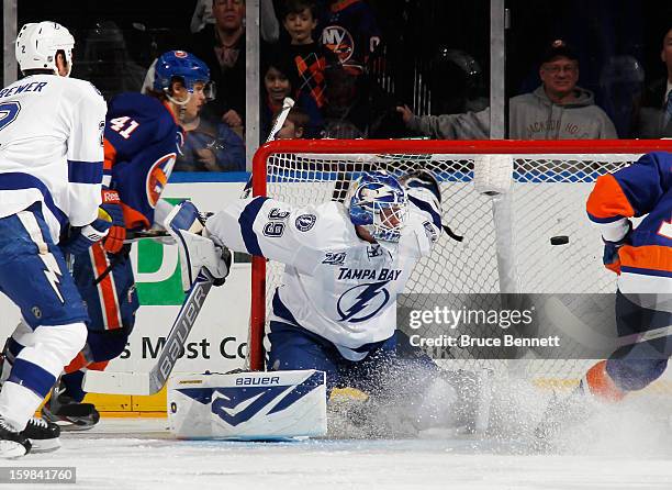 David Ullstrom of the New York Islanders scores a third period goal against Anders Lindback of the Tampa Bay Lightning in the third period at the...