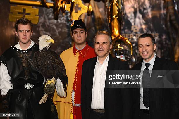 Remy Pagani , Mayor of Geneva poses with Jean-Marc Pontroue , CEO of Roger Dubuis and an eagle at the opening ceremony of the Roger Dubuis booth...