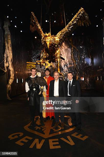 Remy Pagani , Mayor of Geneva poses with Jean-Marc Pontroue , CEO of Roger Dubuis and an eagle at the opening ceremony of the Roger Dubuis booth...