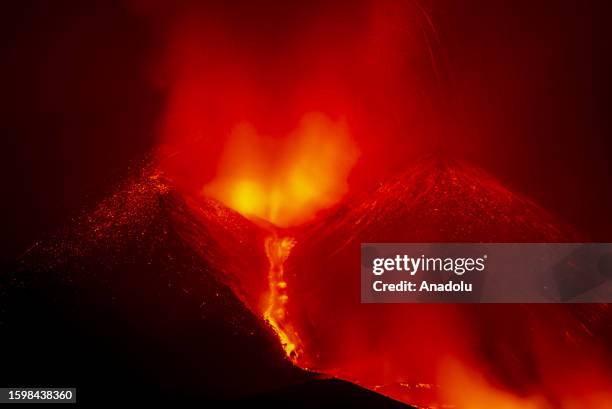 General view of the lava erupting after Etna volcano eruption begins in the late evening of August 13 and produces a fountain of lava from the...