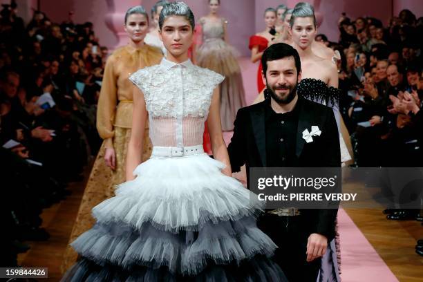 French designer Alexis Mabille acknowledges the public during the Haute Couture Spring-Summer 2013 collection shows on January 21, 2013 in Paris. AFP...