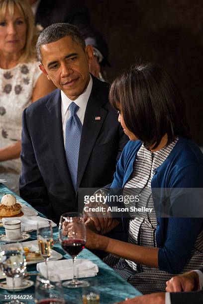 President Barack Obama shares a moment with first lady Michelle Obama at the Inaugural Luncheon in Statuary Hall on inauguration day at the U.S....