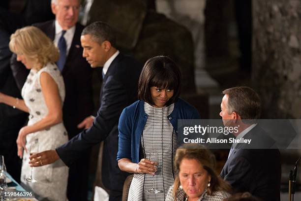 First lady Michelle Obama talks wtih House Speaker John Boehner at the Inaugural Luncheon in Statuary Hall on Inauguration day at the U.S. Capitol...