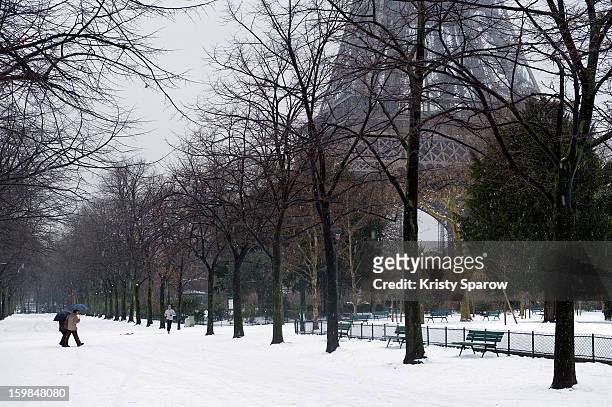 Snow covers the ground around the Eiffel Tower on January 21, 2013 in Paris, France. Heavy snowfall fell throughout Europe and the UK causing travel...
