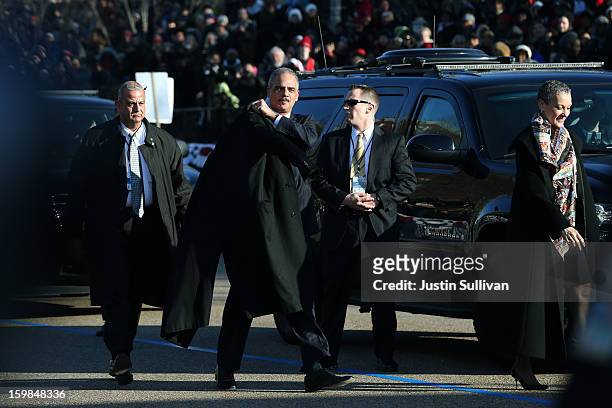 Attorney General Eric Holder walks on the parade route before the presidential inaugural parade wound through the nation's capital January 21, 2013...