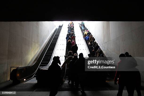 Crowds in route to the National Mall depart the L'Enfant Plaza Metro station to watch the 57th United States Presidential Inauguration ceremony on...