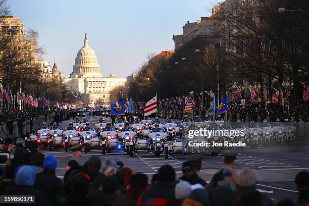 Washington DC police officers lead the inauguration parade on January 21, 2013 in Washington, DC. President Barack Obama was ceremonially sworn in...