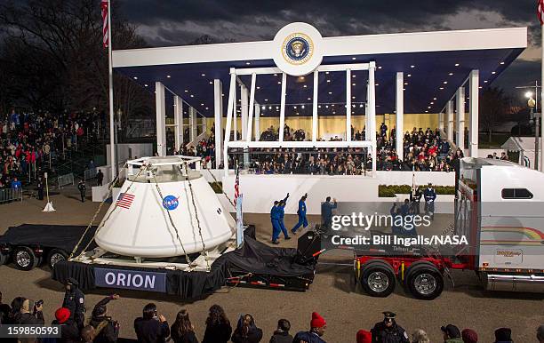 In this handout provided by the National Aeronautic and Space Administration , the Orion space capsule, along with NASA astronauts Lee Morin, Alvin...