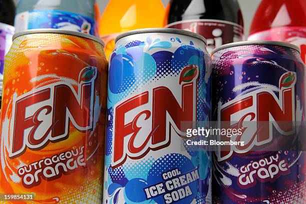 Cans of Fraser & Neave Ltd.'s F&N sparkling drink in various flavors are arranged for a photograph in Singapore, on Monday, Jan. 21, 2013. Thailand's...