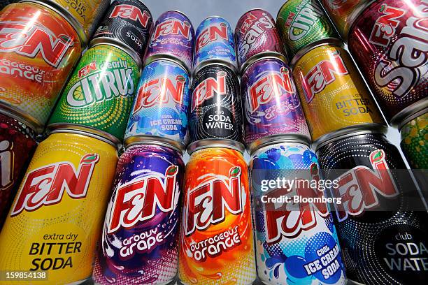 Cans of Fraser & Neave Ltd.'s F&N sparkling drink in various flavors are arranged for a photograph in Singapore, on Monday, Jan. 21, 2013. Thailand's...