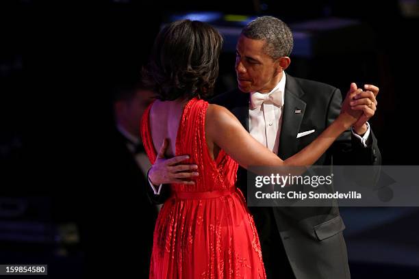 President Barack Obama and first lady Michelle Obama dance at the Commander in Chief Inaugural Ball at the Walter E. Washington Convention Center on...