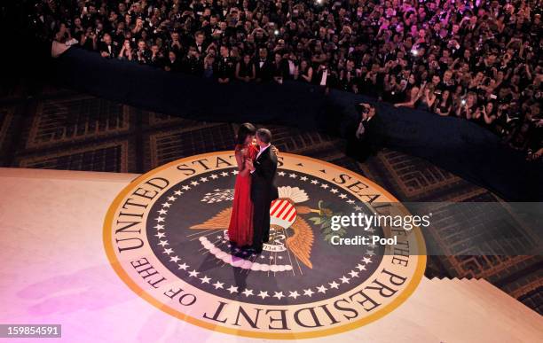 President Barack Obama and first lady Michelle Obama dance together at the Commander-in-Chief's Inaugural Ball at the Washington Convention Center...