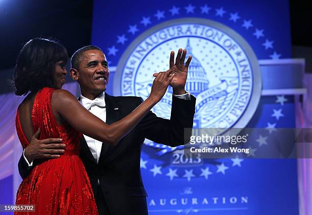President Barack Obama dances with first lady Michelle Obama during the Commander-in-Chief's Inaugural Ball January 21, 2013 at Walter E. Washington...