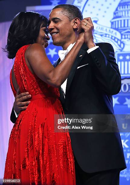 President Barack Obama dances with first lady Michelle Obama during the Inaugural Ball January 21, 2013 at Walter E. Washington Convention Center in...