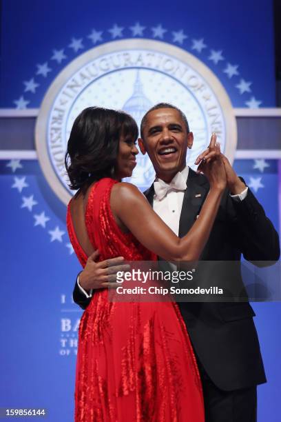 President Barack Obama and first lady Michelle Obama dance together during the Inaugural Ball at the Walter Washington Convention Center January 21,...