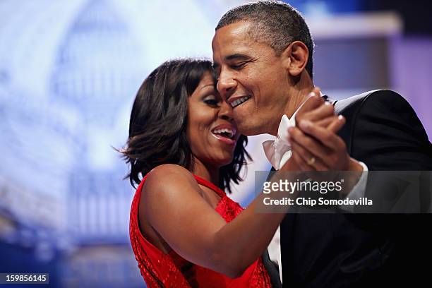 President Barack Obama and first lady Michelle Obama sing together as they dance during the Inaugural Ball at the Walter Washington Convention Center...