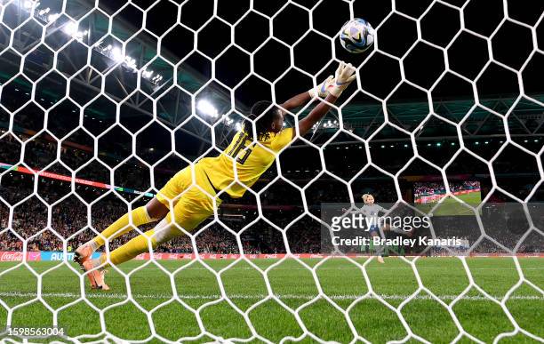 Chiamaka Nnadozie of Nigeria dives in vain as Chloe Kelly of England scores the goal in the penalty shoot out during the FIFA Women's World Cup...