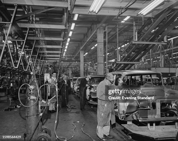 Men working on the assembly line at the Vauxhall Motors car factory in Luton, Bedfordshire, October 7th 1959.