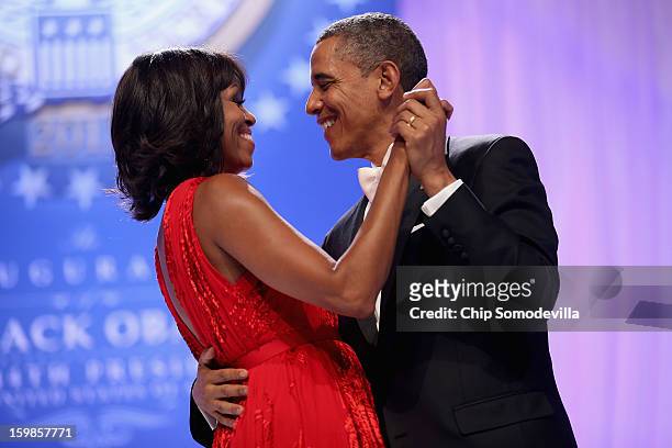President Barack Obama and first lady Michelle Obama dance together during the Comander-in-Chief's Inaugural Ball at the Walter Washington Convention...