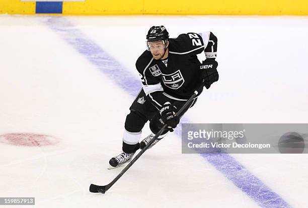Trevor Lewis of the Los Angeles Kings carries the puck through the netural zone during the NHL game against the Chicago Blackhawks at Staples Center...