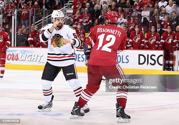 Brandon Bollig of the Chicago Blackhawks squares off in a fight with Paul Bissonnette of the Phoenix Coyotes during the second period of the NHL game...