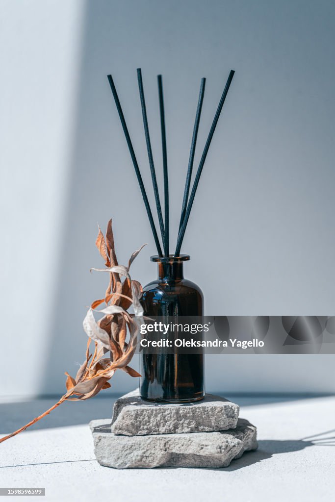 Aroma diffuser bottle with black wooden sticks